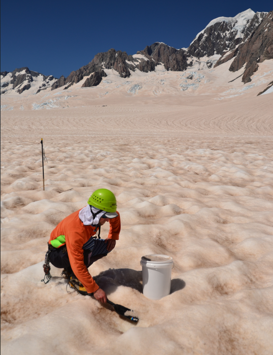 Person with helmet in snowy mountains